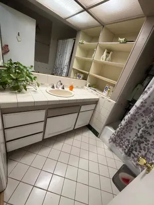 a bathroom with a sink and a mirror at Citrus Loft Room B - Quiet and Convenience Female Only in Covina
