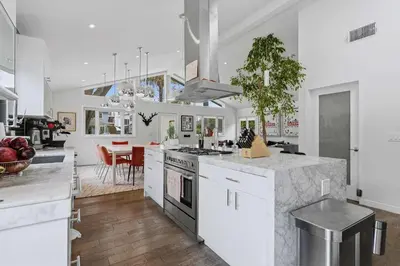 a kitchen with white cabinets and a counter top at New Listing West LA Urban Oasis by Colby & Conrad in Los Angeles