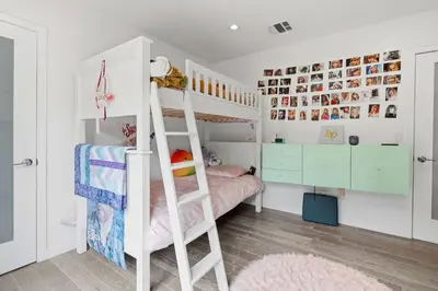 a room with a bunk bed and a ladder at New Listing West LA Urban Oasis by Colby & Conrad in Los Angeles