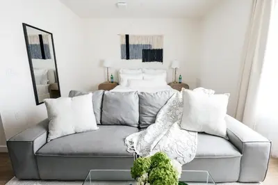 a living room with a couch and a bed at Platinum Space in WeHo in Los Angeles