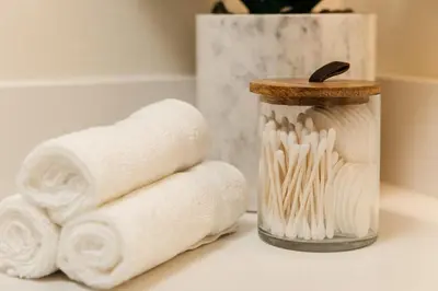 a stack of toilet paper next to a container of towels at Platinum Space in WeHo in Los Angeles