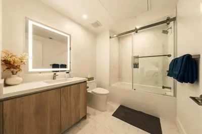 a bathroom with a sink and a toilet and a shower at The Velvet Coast - Grand 3BR Artistic Haven in Los Angeles