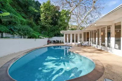 a swimming pool in the backyard of a house at Beverly Hills Canyon Estate by Colby & Conrad in Los Angeles