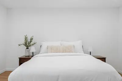 a white bed with white sheets and pillows at Beverly Hills Canyon Estate by Colby & Conrad in Los Angeles