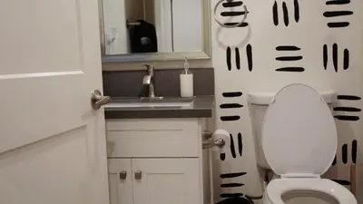 a small bathroom with a toilet and a sink at Pop Art Themed Bedroom in House-Shared Bathroom-Shared Living Room & Kitchen in Los Angeles