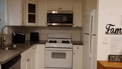 a kitchen with a white stove and a refrigerator at Pop Art Themed Bedroom in House-Shared Bathroom-Shared Living Room & Kitchen in Los Angeles