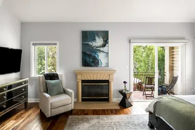 a bedroom with a fireplace and a bed and a tv at Sherman Oaks Home w Pool, Spa and Outdoor Kitchen in Los Angeles