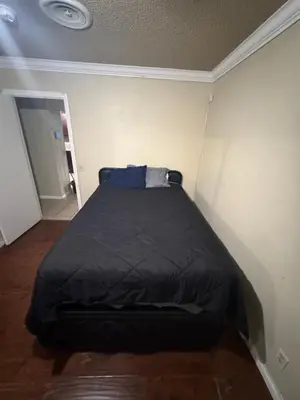 a small bedroom with a bed in the corner at Oldfield in Lancaster