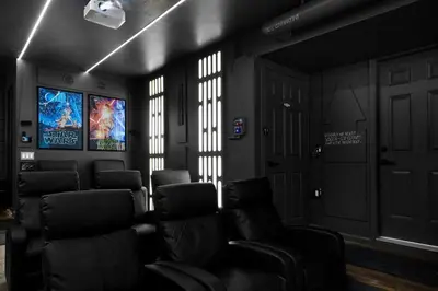 a room with chairs and a tv in it at Star Wars Retreat by OC Adventure Homes in Garden Grove