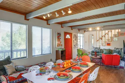 a living room with a table with fruit on it at Mtn Views Near Hiking Pine Mountain Club Getaway! in Pine Mountain Club