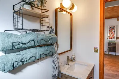 a bathroom with a mirror and a sink at Mtn Views Near Hiking Pine Mountain Club Getaway! in Pine Mountain Club