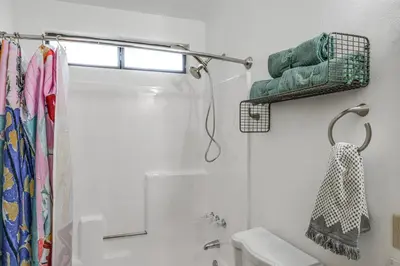 a bathroom with a shower and a toilet at Mtn Views Near Hiking Pine Mountain Club Getaway! in Pine Mountain Club