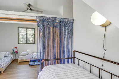 a bedroom with a bed and a window at Mtn Views Near Hiking Pine Mountain Club Getaway! in Pine Mountain Club