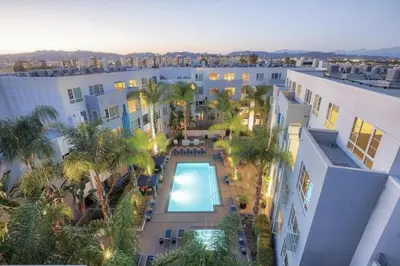 an overhead view of a building with a swimming pool at 3BR 2BTH Santa Monica Apartment - Pool, Balcony, Near LAX in Los Angeles