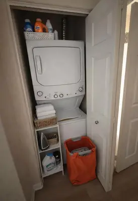 a small refrigerator with a tv in a room at Coastal Modern in MDR in Los Angeles
