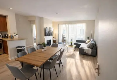 a living room with a table and chairs and a couch at Marina del Rey Luxury 2BR 2BA - Close to Venice Beach in Los Angeles