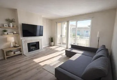 a living room with a couch and a fireplace at Marina del Rey Modern 2BR 2BA & Near Venice Beach Boardwalk in Los Angeles