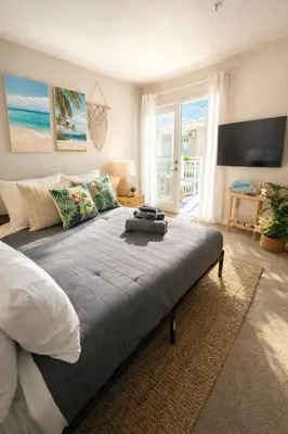 a bedroom with a large bed with a view of the ocean at Marina del Rey Spacious 2BR 2BA - Venice Beach Minutes Away in Los Angeles