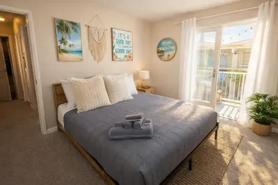 a bedroom with a bed with a towel on it at Marina del Rey Spacious 2BR 2BA - Venice Beach Minutes Away in Los Angeles