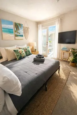 a bedroom with a large bed with a view of the ocean at Marina del Rey 2BR-2BA Coastal Retreat Near Venice Beach in Los Angeles