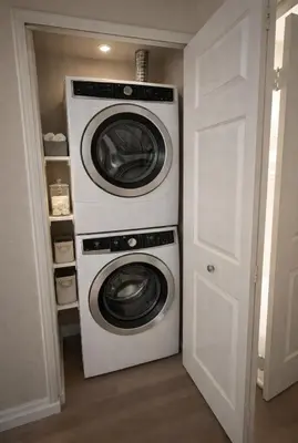 two washing machines stacked on top of each other in a closet at Marina del Rey Prime Location & Venice in Los Angeles