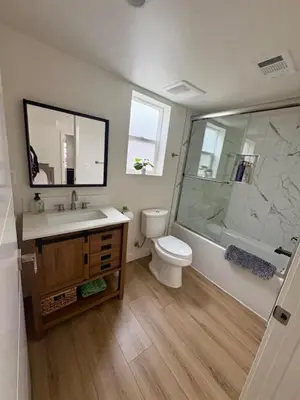 a bathroom with a toilet and a sink and a shower at Modern 3Bedroom 3Bath Townhouse in Sherman Oaks