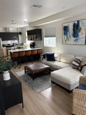 a living room with a couch and a kitchen at Modern 3Bedroom 3Bath Townhouse in Sherman Oaks