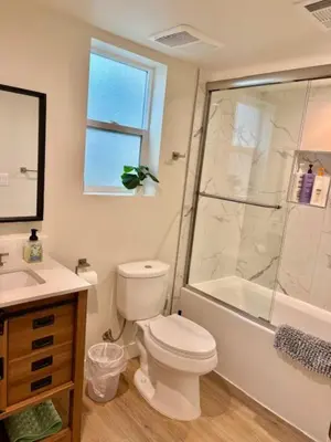 a bathroom with a toilet and a shower and a sink at Modern 3Bedroom 3Bath Townhouse in Sherman Oaks