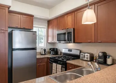 a kitchen with a stainless steel refrigerator and a sink at Marina del Rey Retreat 2BR--2BA & Close To Venice Beach in Los Angeles