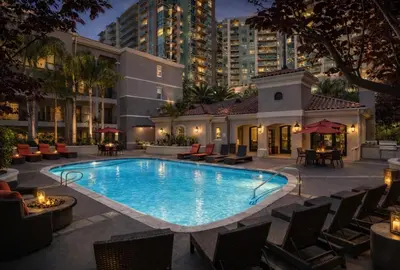 a swimming pool with chairs and a building at Marina del Rey Cozy 1BR - Near Venice Beach in Los Angeles