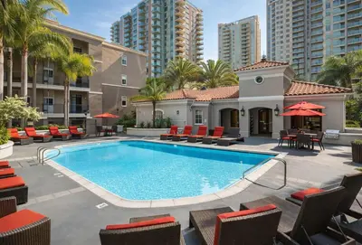an outdoor swimming pool with chairs and tables at Marina del Rey 1BR Retreat - Venice Beach in Los Angeles