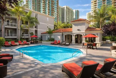 a swimming pool with chairs and a building at Marina del Rey 1BR Retreat - Venice Beach in Los Angeles