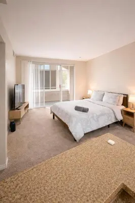a bedroom with a large bed and a television at Marina del Rey 1BR Escape & Venice Beach in Los Angeles