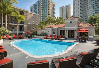 an outdoor swimming pool with chairs and tables at Marina del Rey 1BR Escape Near Docks, Close To Venice Beach in Los Angeles