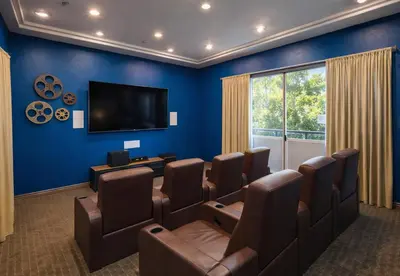 a waiting room with a flat screen tv and brown chairs at Marina del Rey 1BR Escape Near Docks, Close To Venice Beach in Los Angeles
