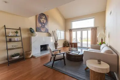 a living room with a couch and a fireplace at Beautiful Monterey Park Home With a View, Backyard and BBQ in Monterey Park