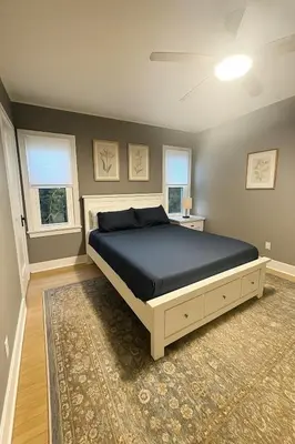 a bedroom with a bed and two windows at Altadena Retreat Near Rose Bowl and Pasadena in Altadena