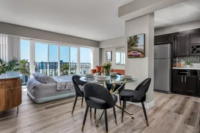 a kitchen and dining room with a table and chairs at Marina Chic Apartment! Free Parking in Los Angeles