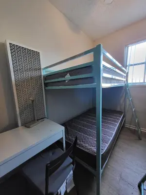 a room with a bunk bed and a desk at Bunk bed spot available, Central LA in Los Angeles
