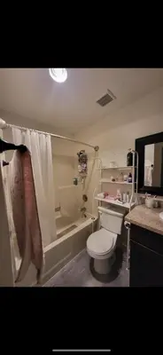 a bathroom with a tub and a toilet and a shower at Bunk bed spot available, Central LA in Los Angeles