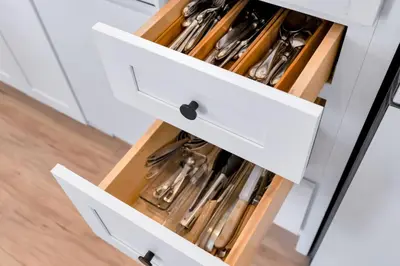 a white kitchen with a drawer full of utensils at NEW Venice Rose Ave Retreat with Sunset Deck in Los Angeles