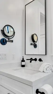 a white bathroom with a sink and a mirror at NEW Venice Rose Ave Retreat with Sunset Deck in Los Angeles