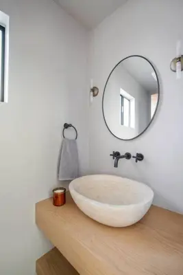 a bathroom with a large white sink and a mirror at Pacific Breeze - Modern Venice Beach Home in Los Angeles