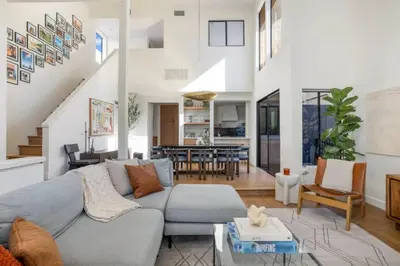 a living room with a couch and a table at Pacific Breeze - Modern Venice Beach Home in Los Angeles