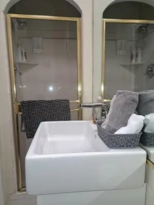 a bathroom with a white sink and a mirror at 3 bedroom plus 2 baths in Beverly hills in Los Angeles