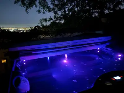 a swimming pool at night with lights on it at Sunset villa in Los Angeles