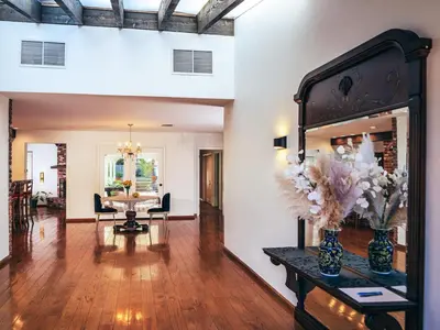 a living room with a table and a dining room at Sunset villa in Los Angeles