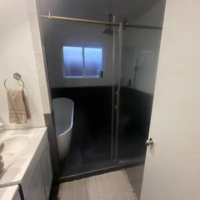 a bathroom with a shower and a toilet and a sink at Pet Friendly Private Guest Suite in Northridge in Northridge