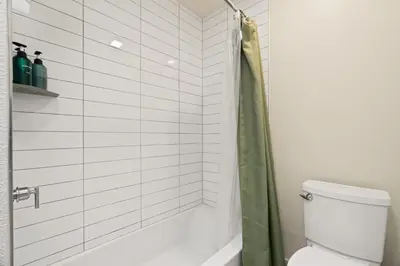 a bathroom with a shower and a toilet at Drift & Dream - Opulent 1BR Marina Escape in Los Angeles