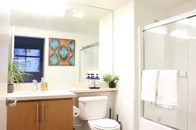 a bathroom with a toilet and a sink and a shower at Santa Monica Place with Free Parking in Los Angeles
